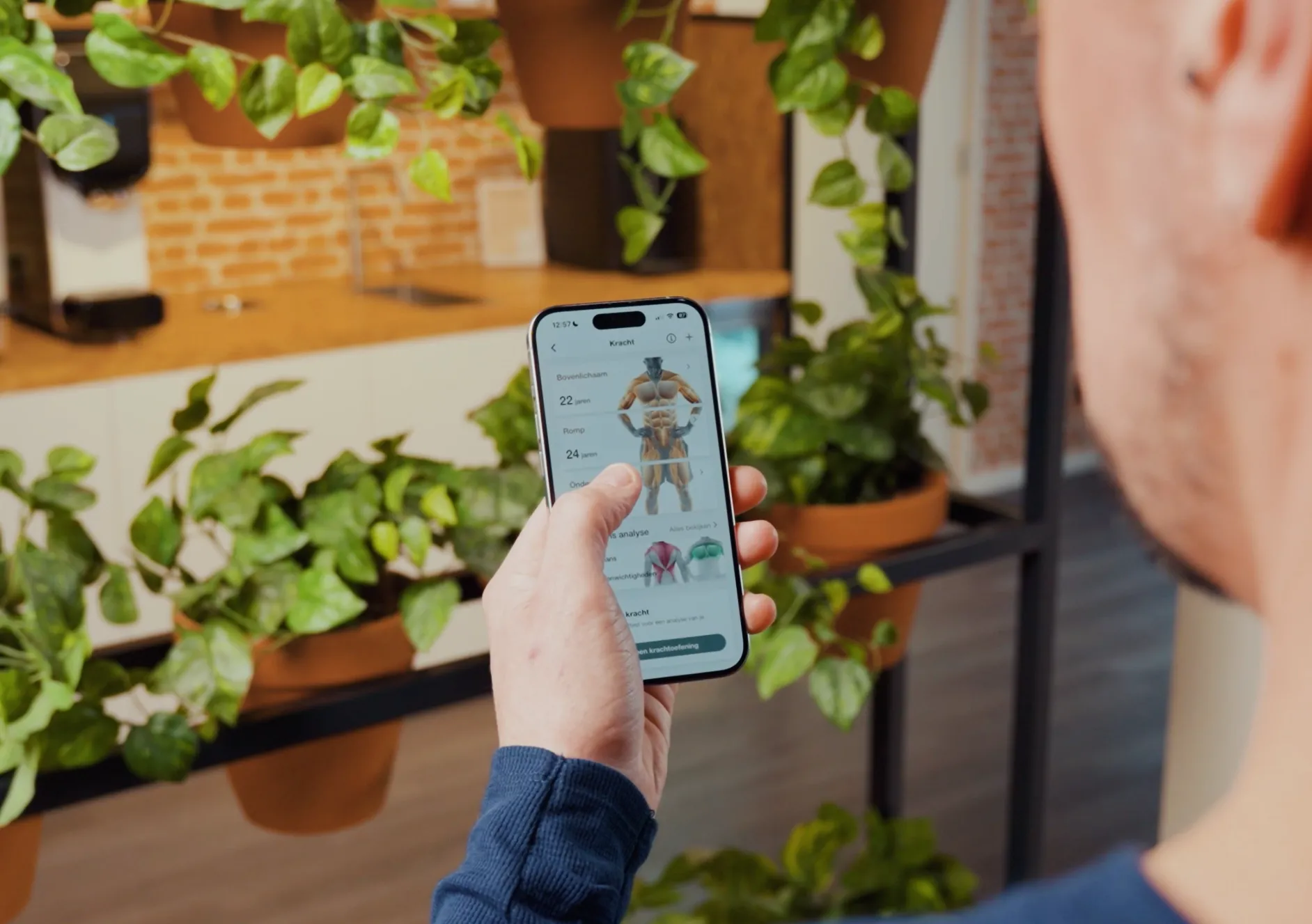 Lid bekijkt in de app een overzicht van spiergroepen en prestaties